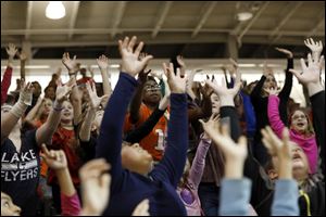 Kids cheer on Bowling Green's women's basketball team as they play Xavier Wednesday.