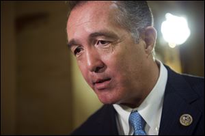 Rep. Trent Franks, R-Ariz. speaks with a reporter on Capitol Hill in Washington. Franks says he is resigning Jan. 31 amid a House Ethics Committee investigation of possible sexual harassment. 