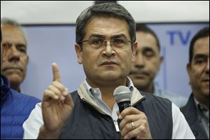 Honduran President Juan Orlando Hernandez speaks during a news conference in Tegucigalpa, Honduras.