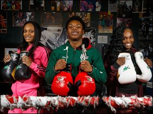Oshae Jones, left, her brother Otha Jones III, 17, center, and fellow boxer Nashay Bradford, 15, recently took first place in their divisions at 2017 USA Boxing Elite and Youth National Championships & Junior and Prep Open in Salt Lake City, Utah. The athletes are pictured at their home gym, Soul City Boxing in Toledo. 