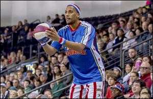 Zeus McClurkin of the Harlem Globetrotters takes a shot from the seating area during a recent show. 