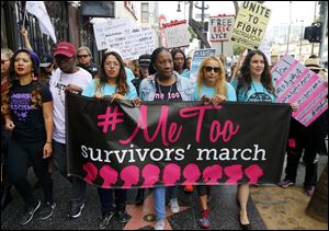 Participants march against sexual assault and harassment at the #MeToo March in the Hollywood section of Los Angeles on Nov. 12, 2017. 