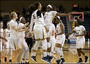 Toledo's Jada Woody (35) and Sarah St-Fort celebrate after the Rockets defeated Ball State Wednesday at Savage Arena.