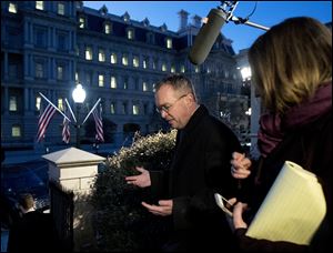 Office of Management and Budget Director Mick Mulvaney, is surrounded by reporters following a TV interviewed about a possible government shutdown Jan. 19.