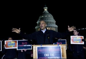 Sen. Cory Booker D-N.J., speaks during a rally in support of the Deferred Action for Childhood Arrivals (DACA), and to avoid the government shut down on Capitol Hill, Friday, Jan. 19.