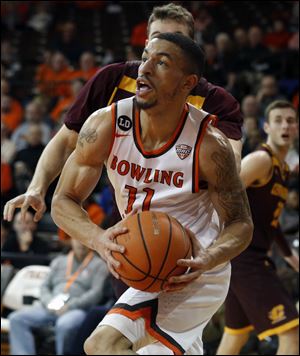Bowling Green State University's Antwon Lillard takes the ball to the hoop against Central Michigan.