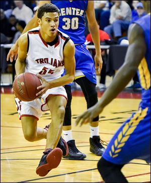 Ronnie Bell (55) of Kansas City's Park Hill High School was committed to play basketball at Missouri State before being notified that Michigan's football team wanted him, as well. 