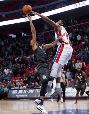 Brooklyn Nets guard Spencer Dinwiddie hits the game winning shot over the defense of Detroit Pistons center Andre Drummond.