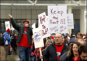 Brian Sims, UAW Local 12 Committeeman, leads a demonstration outside of Cobo Center with about 200 members of UAW Local 12 to draw attention to Fiat Chrysler’s decision to outsource some trucking work.