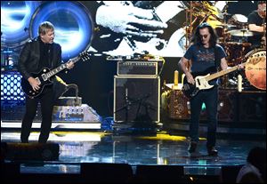 Alex Lifeson and Geddy Lee of Rush perform on stage at the 28th Annual Rock and Roll Hall of Fame Induction Ceremony at Nokia Theatre L.A. Live on April 18, 2013 in Los Angeles. 