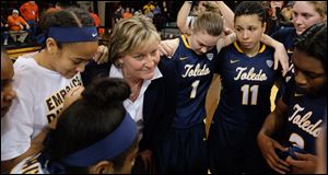Toledo head coach Tricia Cullop huddles with her team after they defeated their rival Bowling Green.