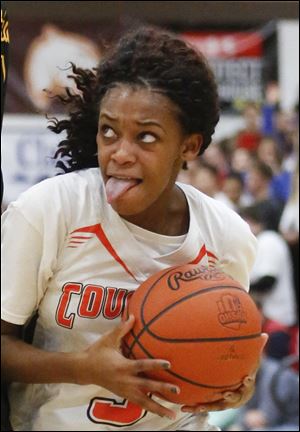 Southview's Charnae Merrell, shown in a game earlier this season, scored 21 points Friday to help the Cougars beat Bowling Green.