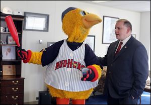 Toledo Mayor Wade Kapszukiewicz interacts with Muddy the Mud Hen in his office at One Government Center on Friday.