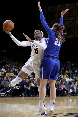Toledo's Kaayla McIntyre shoots around Buffalo's Mariah Suchan during a MAC basketball game at the University of Toledo's Savage Arena in Toledo, Ohio. McIntyre scored 30 points. 