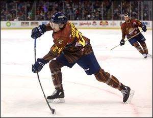 Toledo's Kevin Gibson takes a shot during a game between the Toledo Walleye and Wheeling Nailers at the Huntington Center in Toledo on Dec. 9, 2017.