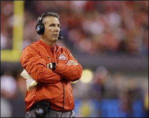 Ohio State head coach Urban Meyer watches the first half of the Big Ten championship game against Wisconsin. The top offensive lineman recruit in the country announced he would sign with the Buckeyes on Wednesday.