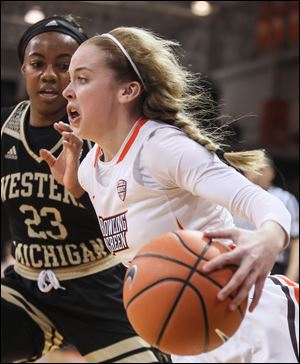 Bowling Green State University guard Kennedy Williams drives past Western Michigan guard Jordan Walker during a MAC basketball game Wednesday, February 7, 2018, in Bowling Green. Western Michigan defeated BGSU 81-67.