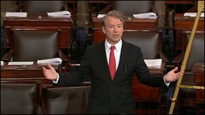 Sen. Rand Paul speaks on the floor of the Senate Thursday, Feb. 8, 2018, on Capitol Hill in Washington. 