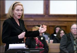 Prosecutor Julia Bates thanks the detectives who worked the Cook brother cases over the years during sentencing at Lucas County Courthouse on April 6, 2000.