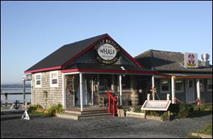 Saint Andrews, New Brunswick, juts into Passamaquoddy Bay on a peninsula near the border between the province and Maine. Businesses line the streets near the bay, which is an inlet from the Bay of Fundy.