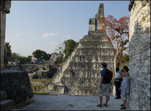  Temples and palaces in Tikal, one of the best known Maya sites in northern Guatemala, March 24, 2005. Not far from the sites tourists already know, laser technology has uncovered about 60,000 homes, palaces, tombs and even highways in the humid lowlands in 2018.