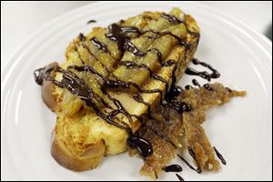 Pictured is Bananas Foster on top of salted caramel peanut butter with dark chocolate drizzle. 