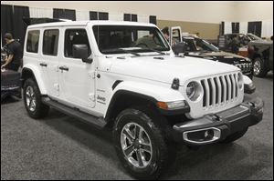 A 2018 Jeep Wrangler on display at the Greater Toledo Auto Show in February. Fiat Chrysler said sales of the Wrangler in February were up 17 percent from the same month in 2017.