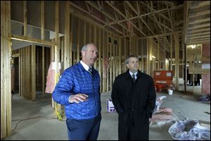 Brian Gruber, Ridgestone General Contractors, left, and John Stout, administrator of St. Luke's Hospital, give a tour of the St. Luke's Family Practice Residency building in Perrysburg. 