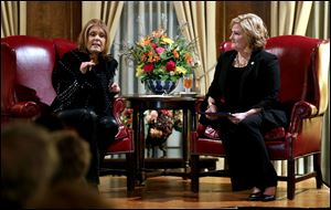 Gloria Steinem, left, and State Rep. Teresa Fedor take the stage in front of supporters to kick off Fedor's state senate campaign at the Toledo Club.