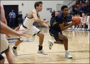 Maumee Valley's Zeb Jackson drives to the basket during Wednesday's district semifinal against Ottawa Hills.