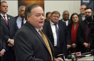 Maumee Mayor Rich Carr speaks before he and leaders from Toledo and the suburban communities that buy its water sign a memorandum of understanding to form the Toledo Area Water Authority Jan. 31 at the Toledo Chamber of Commerce office. 