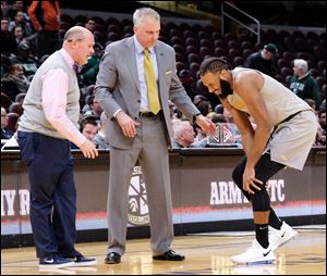 Toledo guard Tre'Shaun Fletcher comes off the court with an injury during Thursday's MAC Tournament quarterfinal game against Miami.