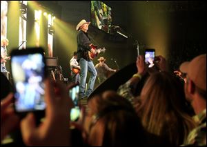 Alan Jackson performs at the Huntington Center in Toledo on Friday.
