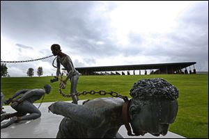 Part of a statue depicting chained people is on display at the National Memorial for Peace and Justice, a new memorial to honor thousands of people killed in racist lynchings in Montgomery, Ala.