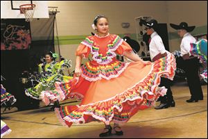 Yirsi Verdin, 12, performs with El Corazon de Mexico Ballet Folklorico dancers. The dance troupe will perform during this week’s Hip Hop Summit.