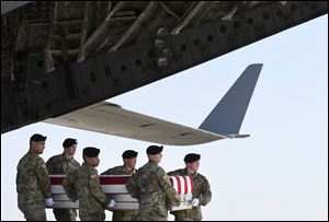 An Army carry team moves a transfer case containing the remains of Spc. Gabriel D. Conde at Dover Air Force Base, Del., on May 3. According to the Department of Defense, Conde, 22, of Loveland, Colo., was killed by enemy fire on April 30in the Tagab District of Afghanistan.