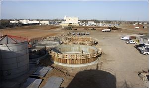 Workers construct fermenter tanks at the new $175 million Element LLC ethanol plant located in southeast Kansas on the site of the demolished High Plains Energy plant in Colwich. The Element plant, which will open in the spring of 2019, is a joint venture between The Andersons Inc., of Monclova Township, and ICM Inc., of Colwich, a firm that develops ethanol plant technologies and designs and builds ethanol plants.
