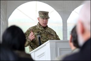 National Guard Col. Edward Hallenbeck addresses a group of Monroe County residents gathered to celebrate the official announcement of a new National Guard Armory in Dundee, Mich. 
