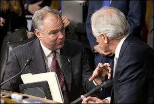 Sen. Bob Corker (R., Tenn.), right, confers with Sen. Tim Kaine (D., Va.) on Capitol Hill. Mr. Corker and Mr. Kaine are co-sponsors of a new Authorization for Use of Military Force.