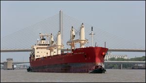 The Canadian boat Federal Champlain makes its way up the Maumee River Wednesday in Toledo. The ship was one of three ships that was effectively stuck in Toledo because of a labor dispute between a local longshoremen's union and a Port of Toledo stevedore. 