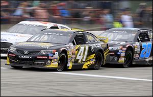 Zane Smith (41) leads Travis Braden, left, and Chandler Smith (20) during the Menards 200 ARCA race at Toledo Speedway.