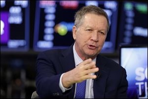 In a March 14, 2018 file photo, Ohio Gov. John Kasich is interviewed on the floor of the New York Stock Exchange. 
