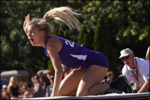 Swanton's Julia Smith, shown celebrating after a jump at last year's state track meet, set a regional record in the high jump Friday in Tiffin.