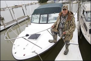 Toledo resident Mike McCroskey, pictured in 2013 at Wild Wings Marina in Oak Harbor, has been giving guided hunting and fishing tours for more than 30 years and calls area the area a 'walleye gold mine.'