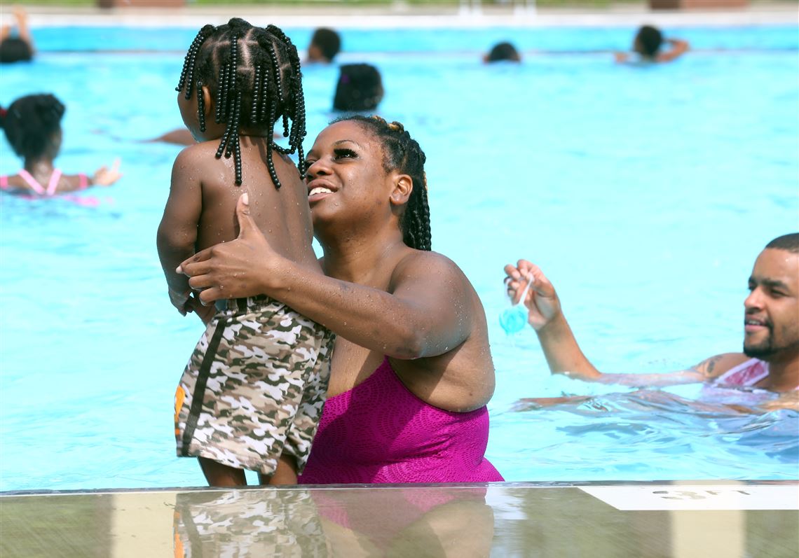 Adults and children enjoy Roosevelt Pool July 9. Toledo's Navarre Pool will open Tuesday after a delay for renovations.