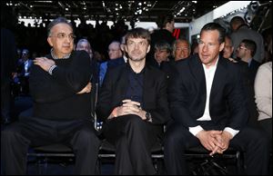 In this January, 2015 file photo, Sergio Marchionne, left, Chief Executive Officer, Fiat Chrysler Automobiles; Michael Manley, President and Chief Executive Officer, Jeep Brand and Reid Bigland, President and CEO of Alfa Romeo, North America watch at media previews for the North American International Auto Show in Detroit.