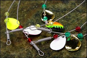 Most perch fishing rigs, such as these spreaders, include a lot of color and flash, which is intended to draw fish to the baits.  