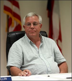 Pioneer Mayor Edward Kidston listens to citizens protest against sharing their water with Toledo suburbs during the Pioneer Village Council meeting.