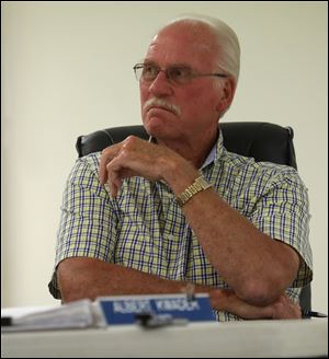 Pioneer councilman Albert Kwader listens to mayor Edward Kidston during the Pioneer Village Council meeting. Mr. Kwader called for his resignation during the meeting.