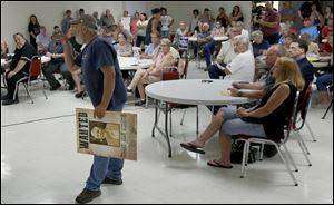 Fayette resident Dan Nicely speaks out against sharing water with Toledo suburbs during the Pioneer Village Council meeting.